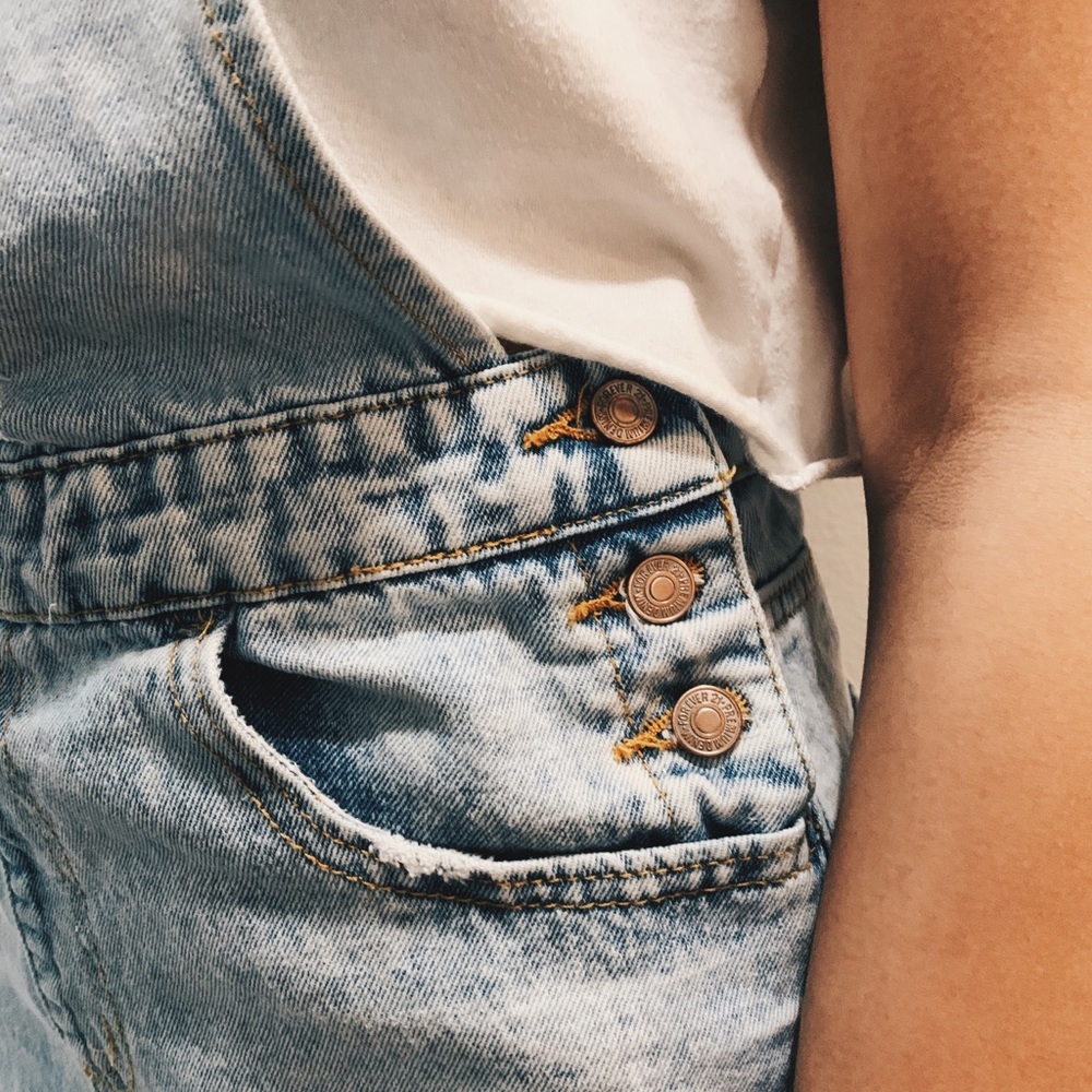 Light wash, distressed mini overall skirt
